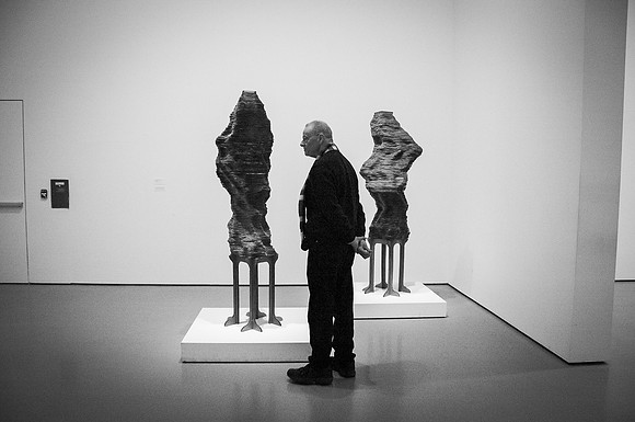 Man and Sculptures